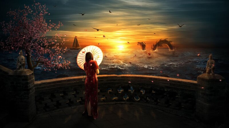 Woman watching sunset over sea