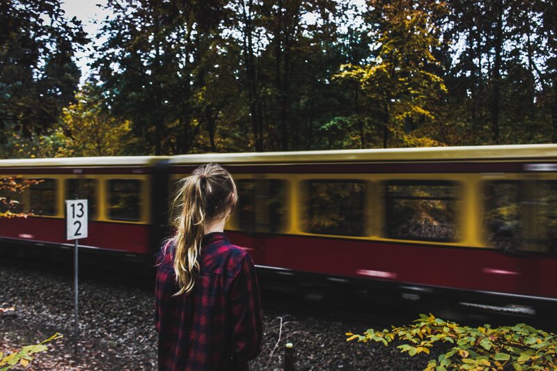 woman watching train pass
