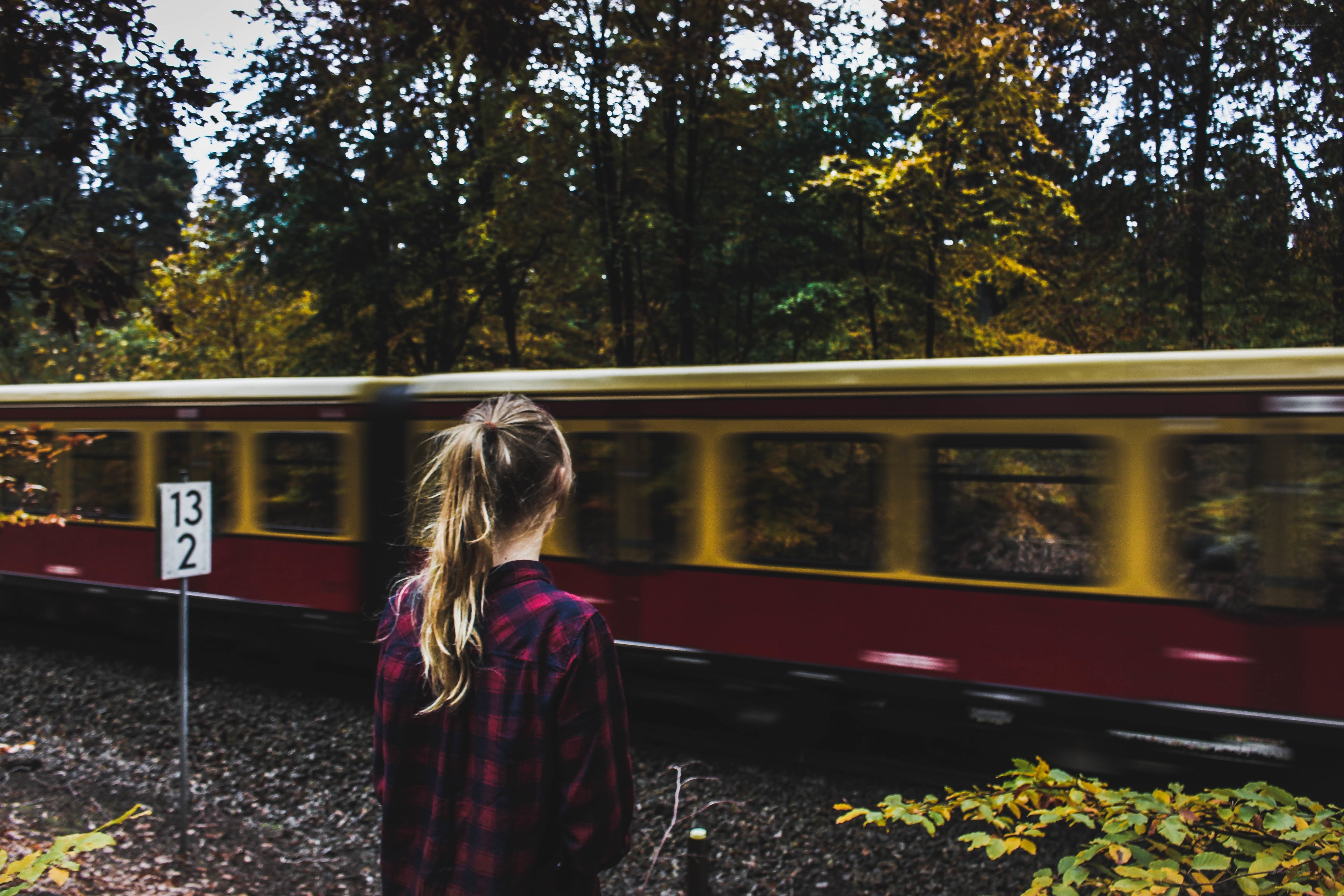 woman watching train pass