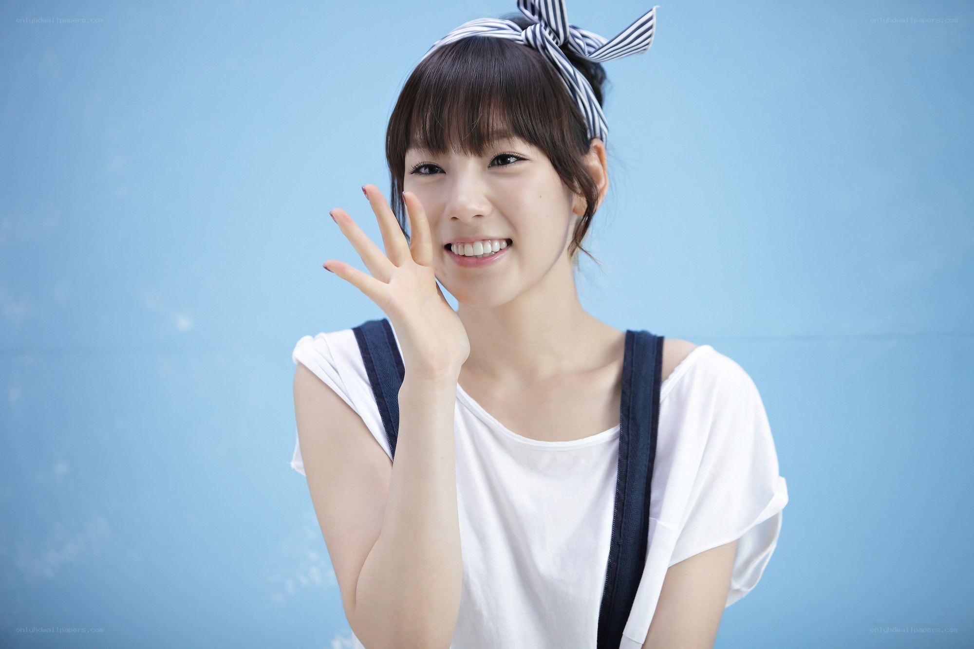 woman waving at camera