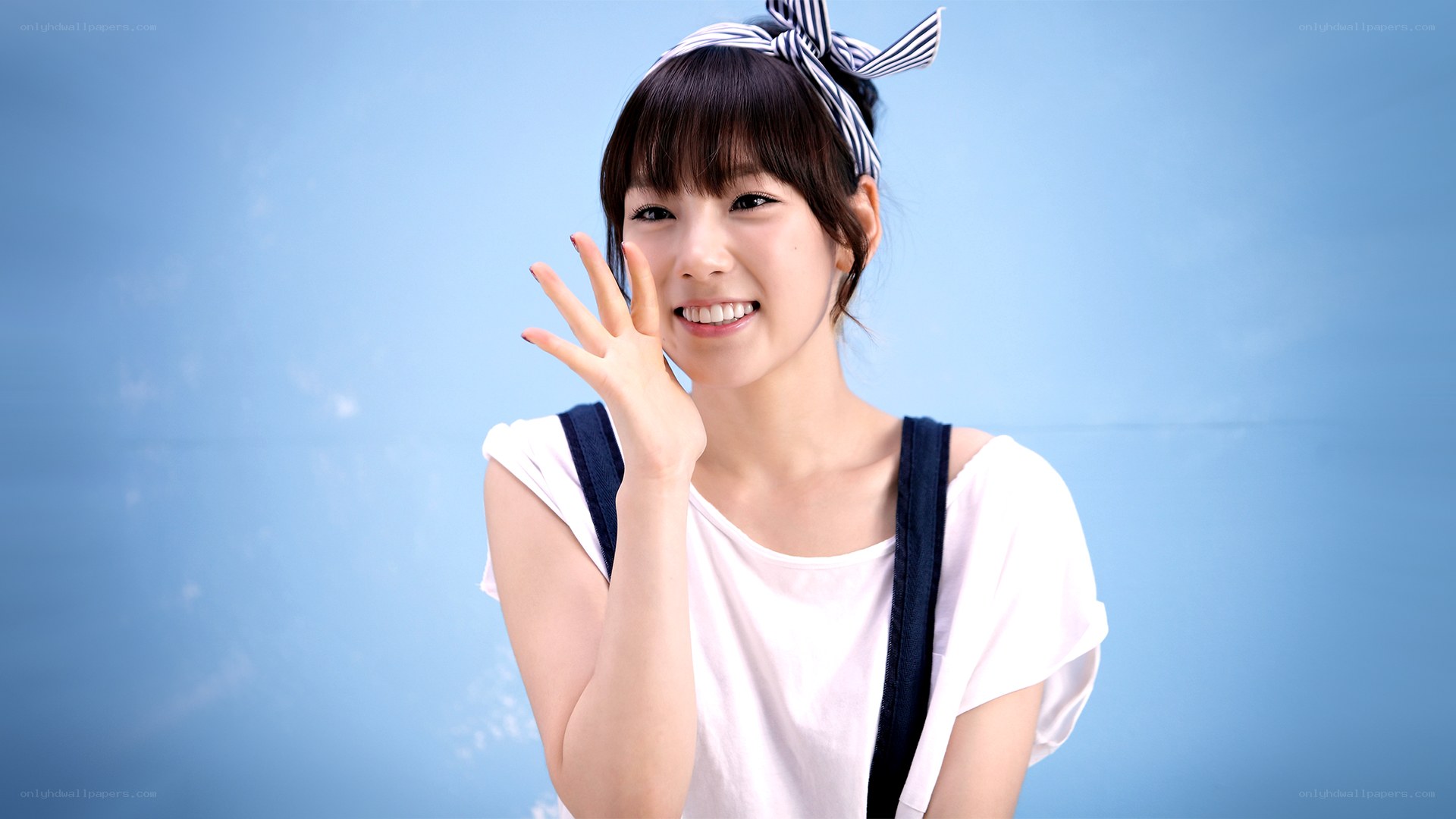 woman waving at camera