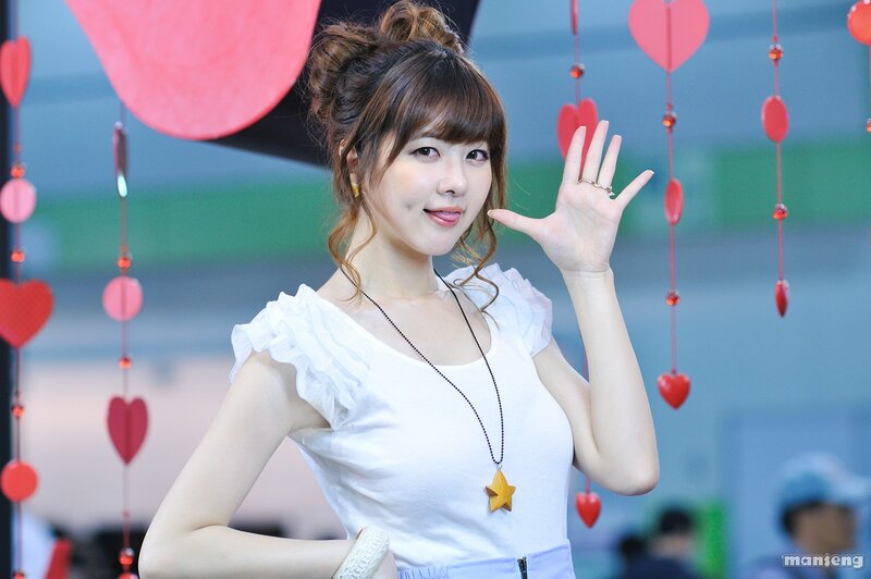 woman waving at camera