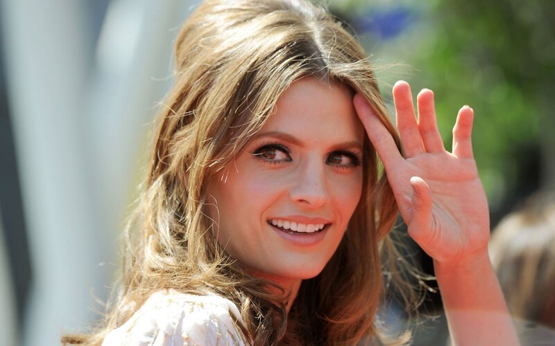 woman waving at camera