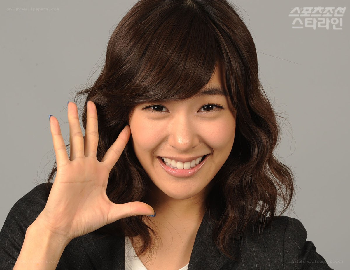 woman waving at camera