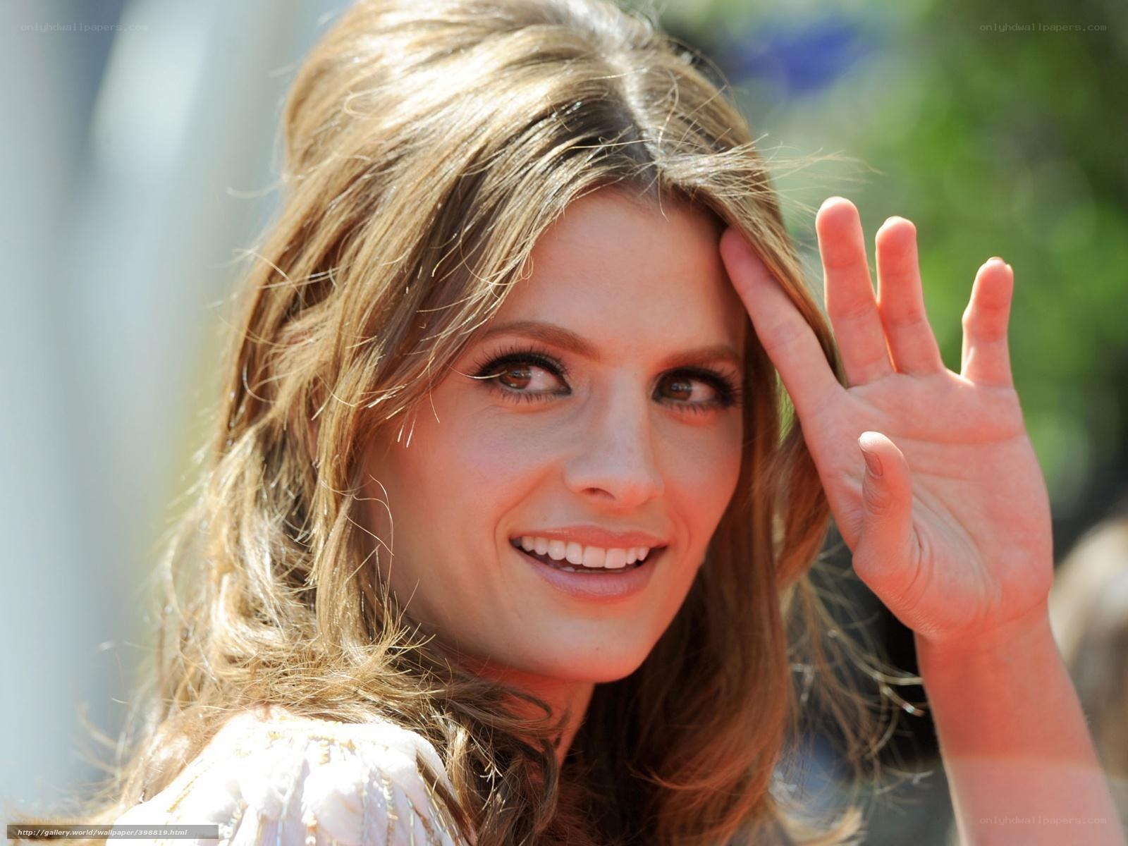 woman waving at camera
