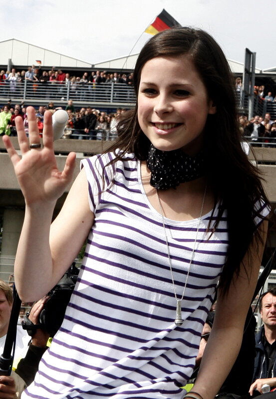 woman waving at crowd
