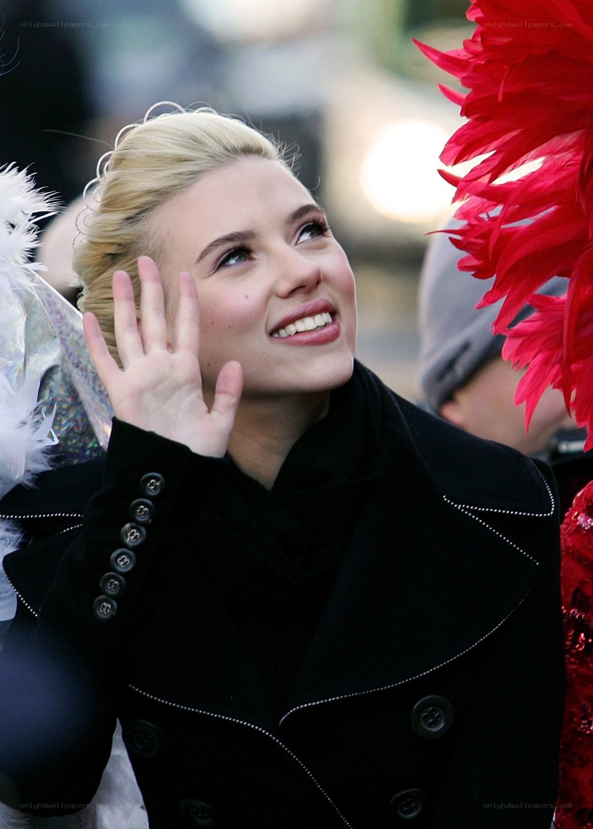 woman waving at crowd