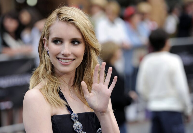 woman waving at event