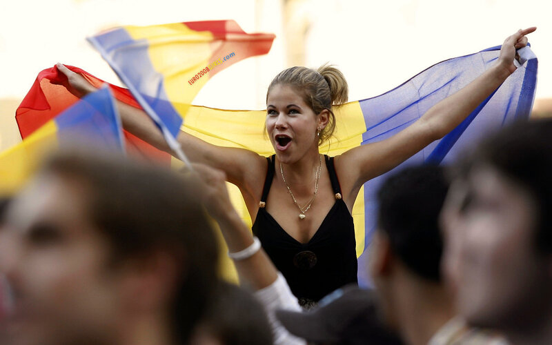 Woman waving flag at rally