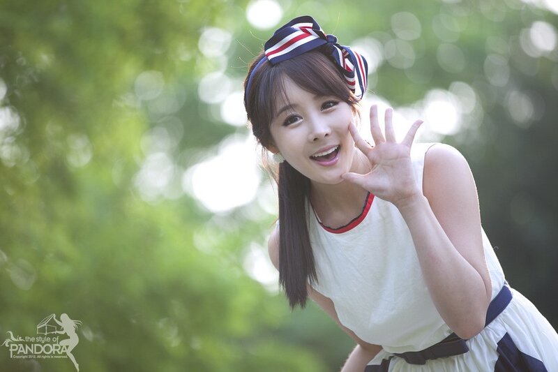 woman waving in park