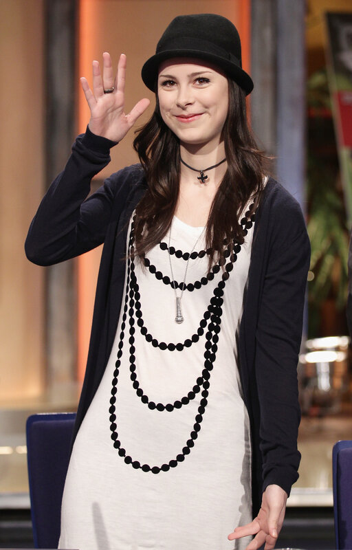 woman waving in studio