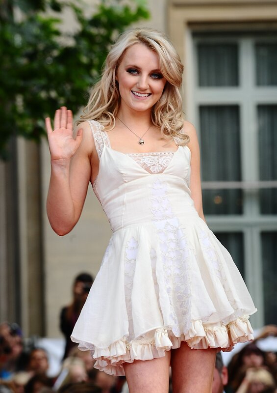 Woman waving in white dress
