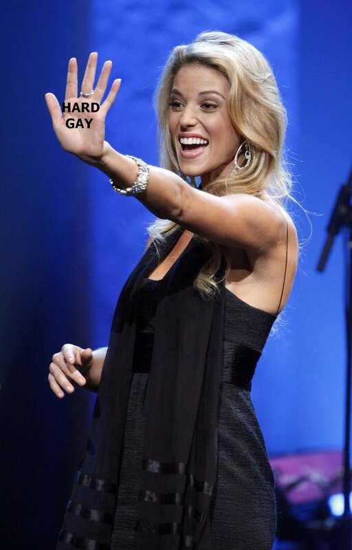 woman waving on stage