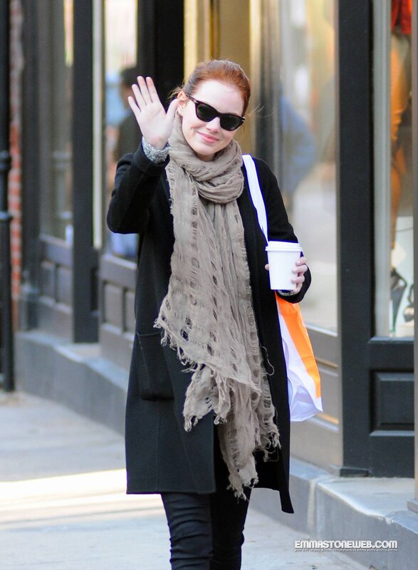 woman waving on street