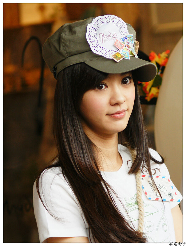 woman wearing a decorated cap