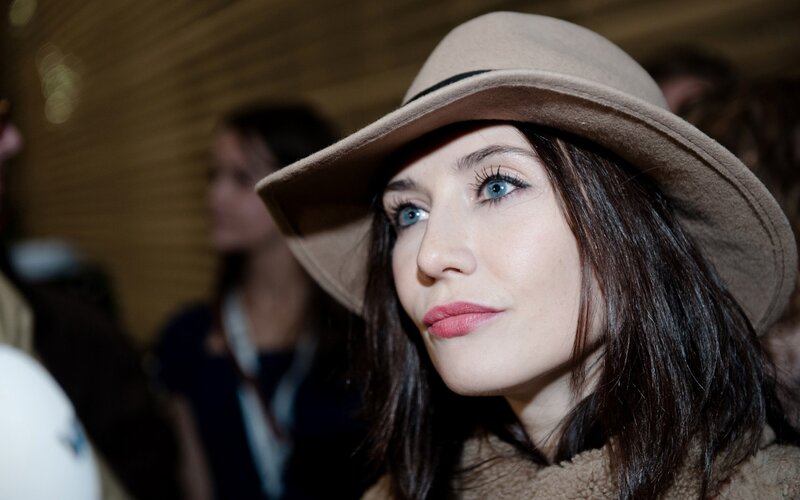 Woman Wearing a Hat — Brown, Neutral