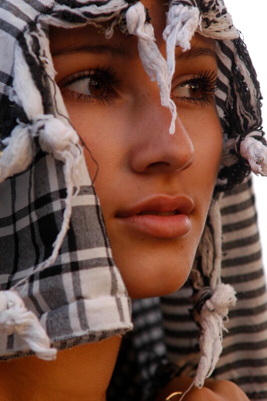 woman wearing a keffiyeh