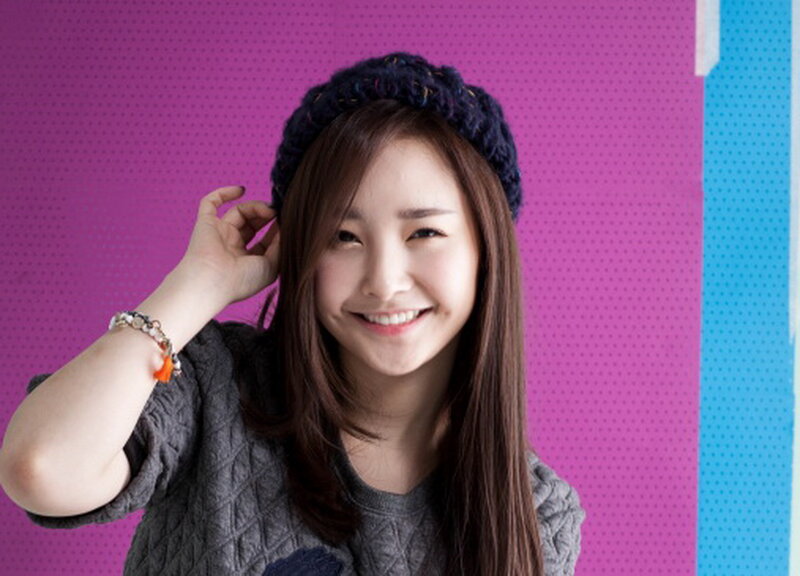 Woman Wearing Beanie — Purple