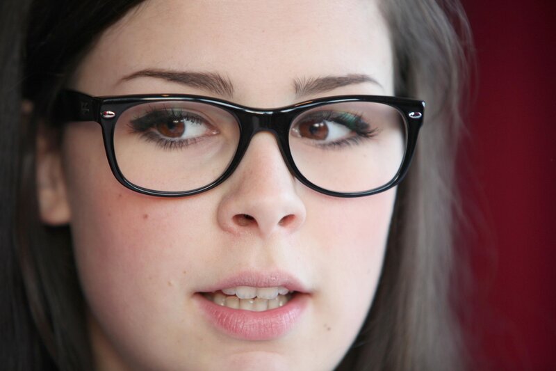 woman wearing black glasses