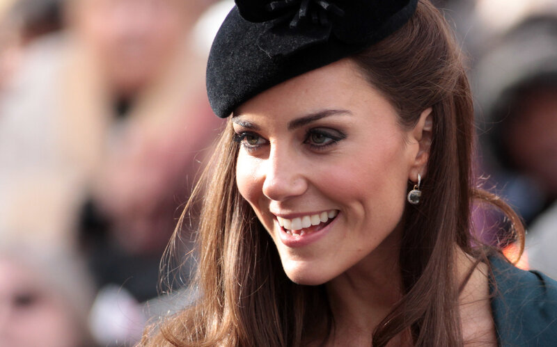 Woman Wearing Black Hat — Brown, Happy