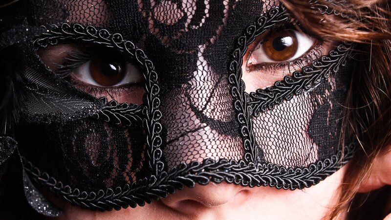 woman wearing black lace mask