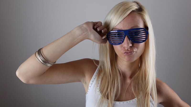 woman wearing blue shutter shades