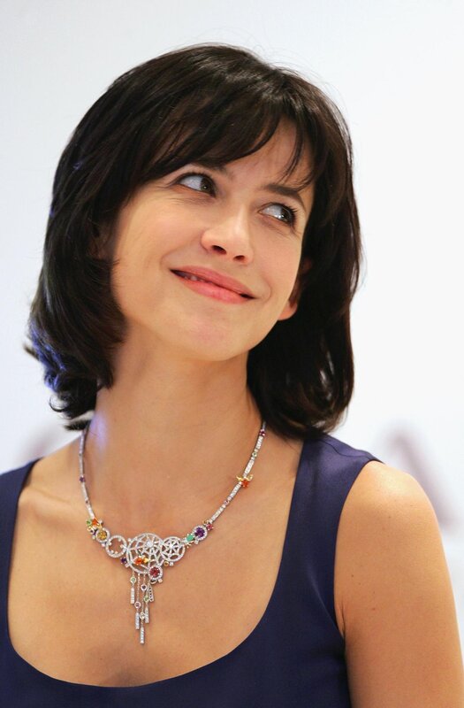 woman wearing colorful necklace