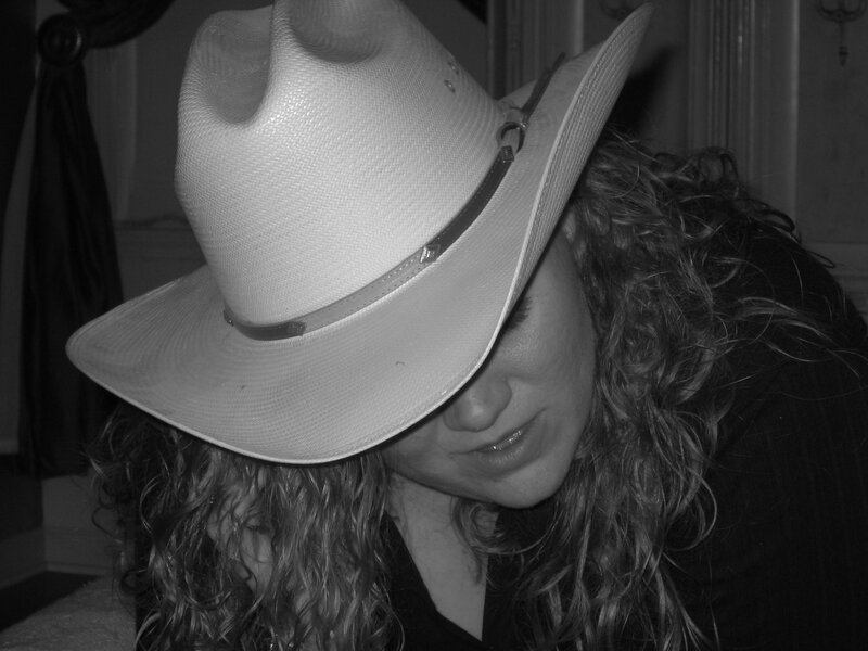 Woman Wearing Cowboy Hat — Black, Contemplative