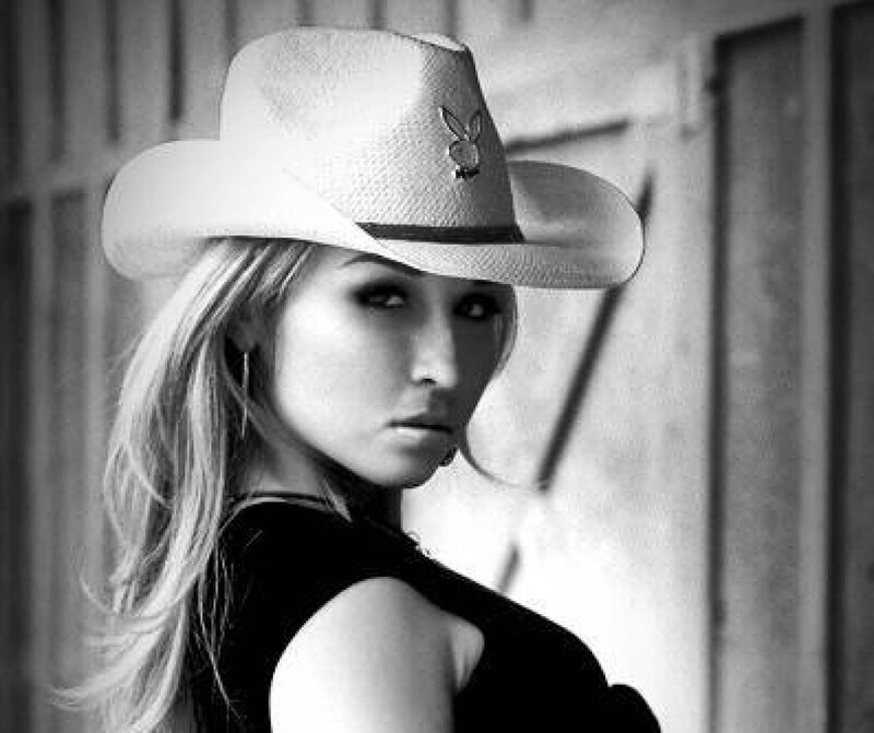 Woman Wearing Cowboy Hat — Black, Serious