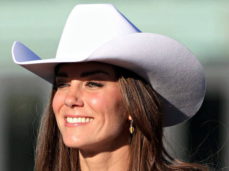 Woman Wearing Cowboy Hat — White, Smiling