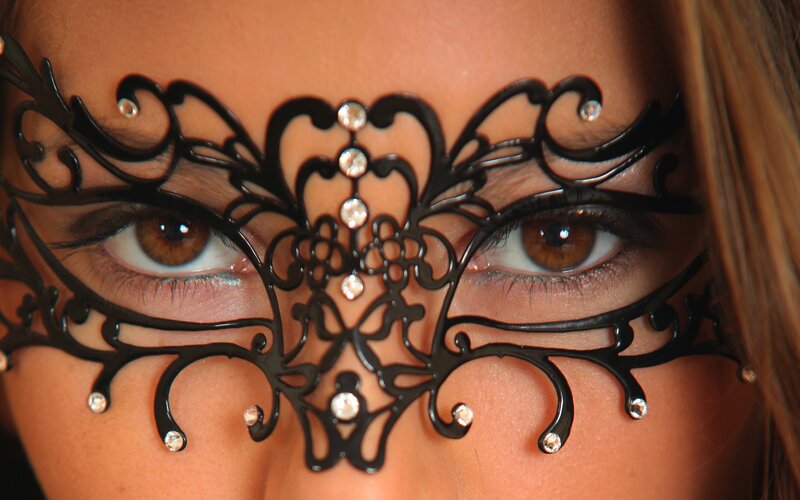 woman wearing decorative mask