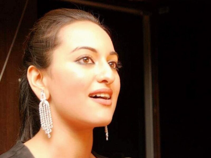 woman wearing diamond earrings
