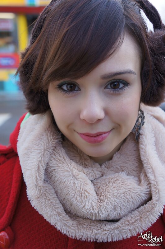 Woman Wearing Earmuffs — Red