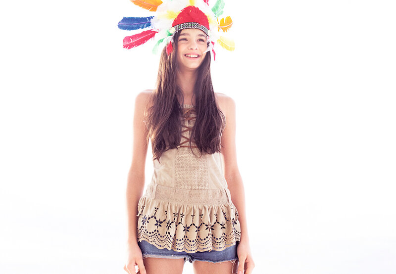 Woman Wearing Feather Headdress — White