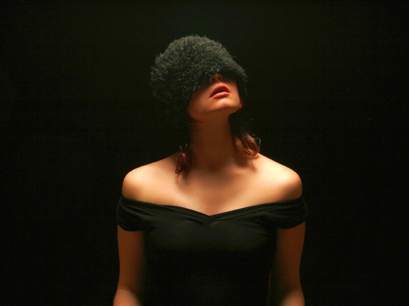 Woman Wearing Fur Hat — Black, Dramatic, Photograph