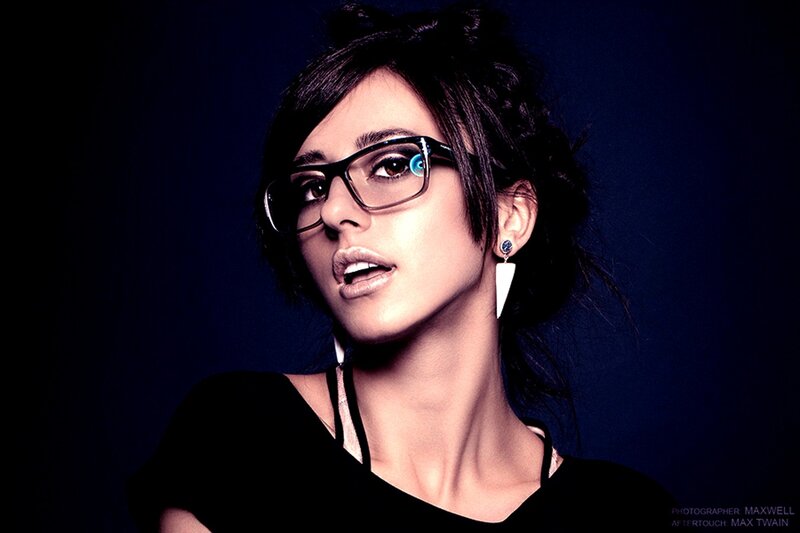 woman wearing glasses and earrings