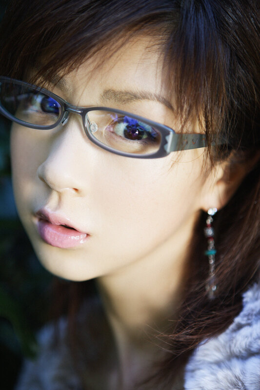 woman wearing glasses and earrings