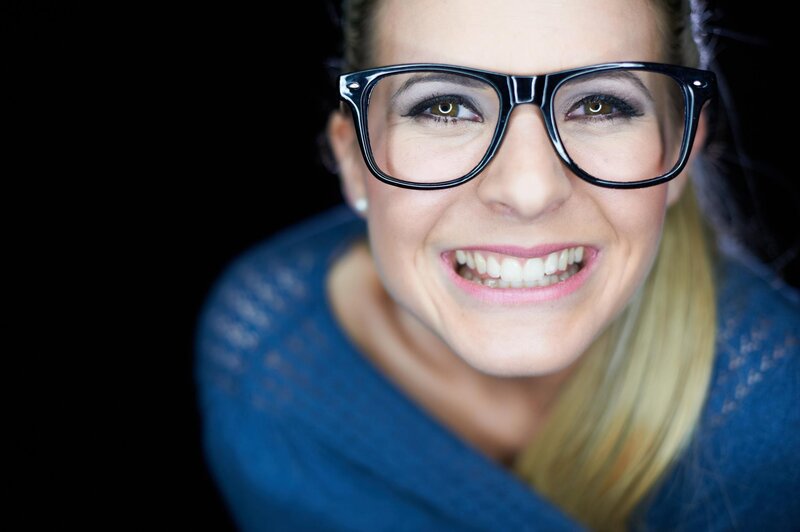 woman wearing glasses smiling