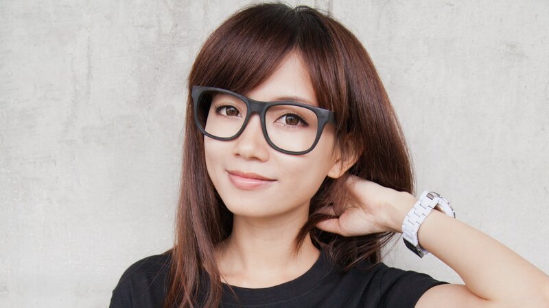 woman wearing glasses smiling