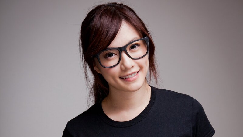 woman wearing glasses smiling