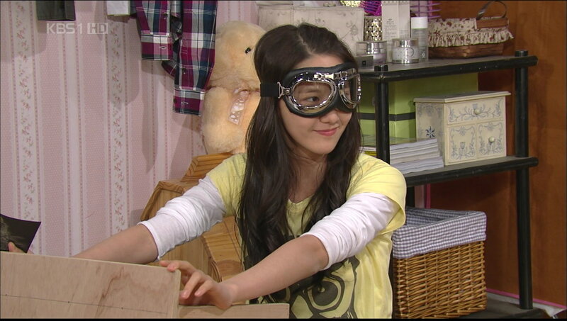 woman wearing goggles in room