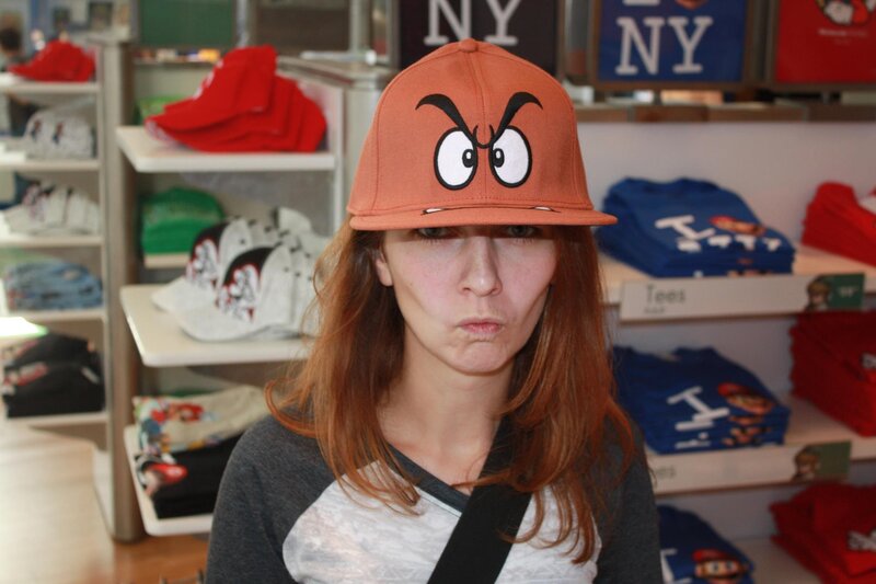 Woman wearing Goomba hat