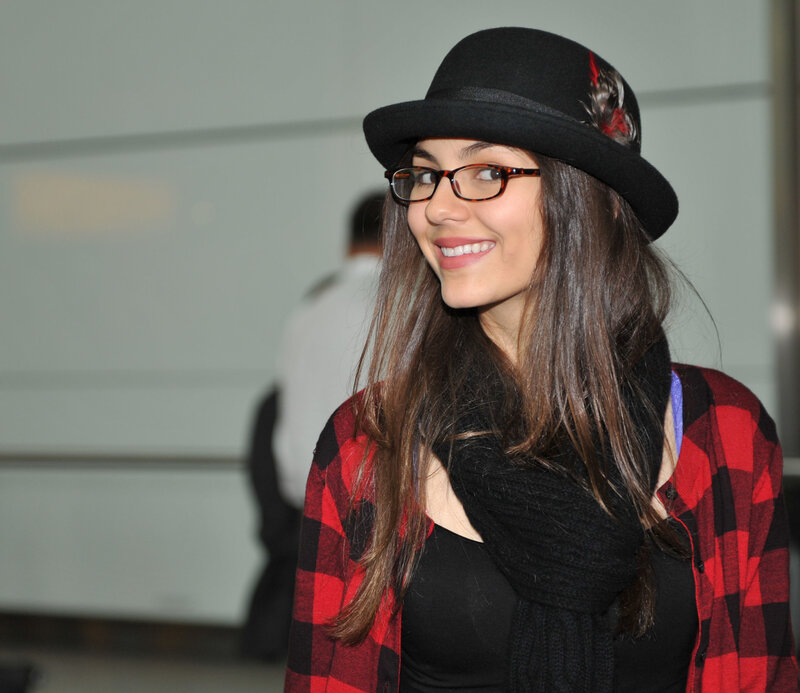 woman wearing hat and glasses