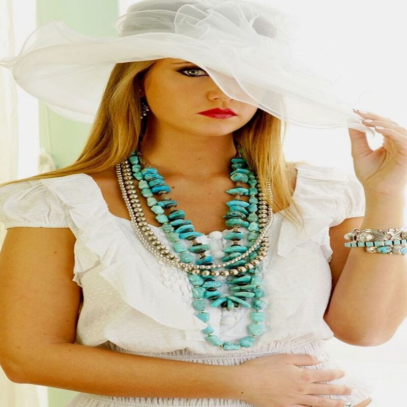 Woman Wearing Hat and Necklaces