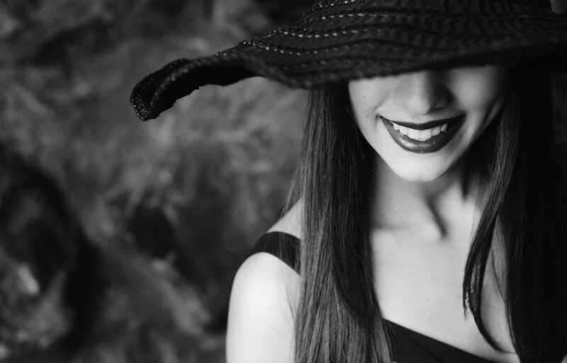 Woman Wearing Hat — Black, Dramatic, Photograph, Smile