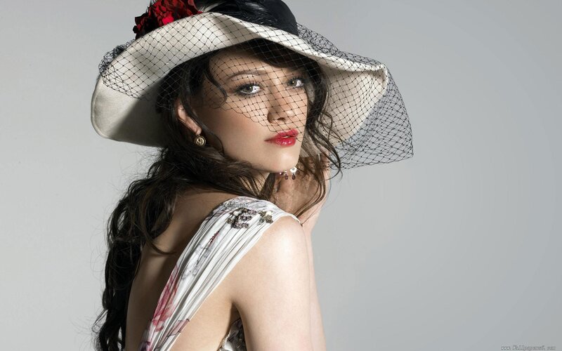 Woman Wearing Hat — White, Dramatic