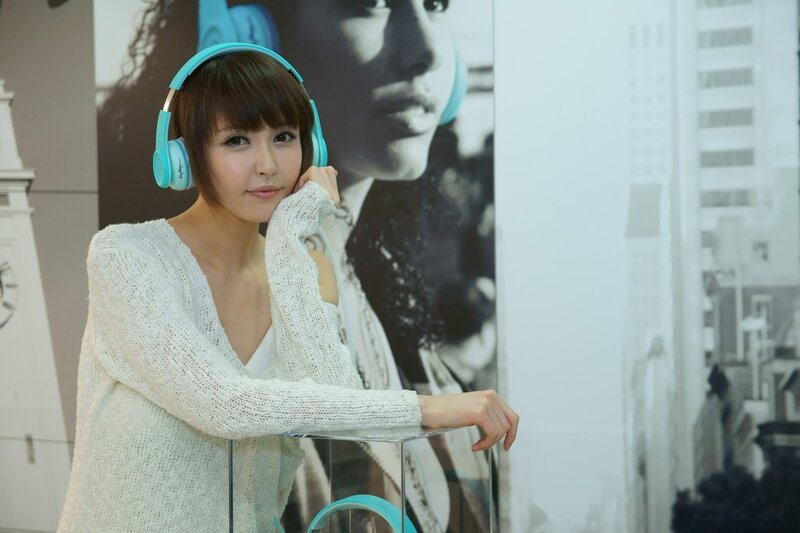 woman wearing headphones at event
