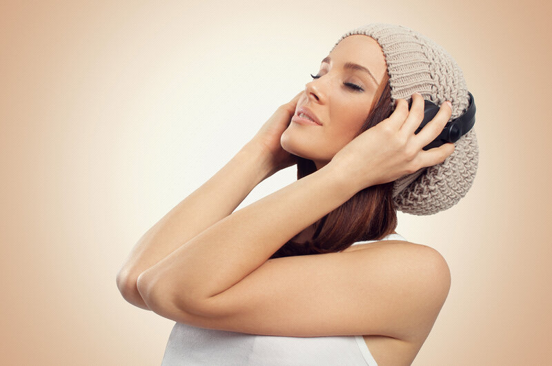 Woman Wearing Headphones — Beige