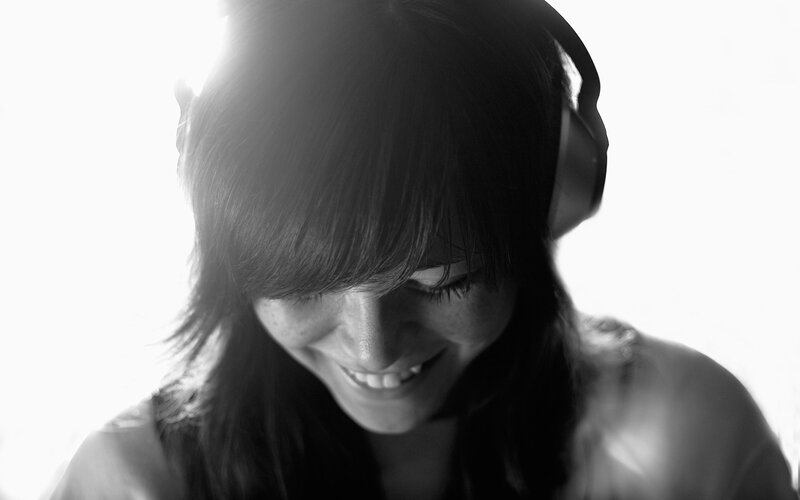 Woman Wearing Headphones — Black, Serene, Photograph