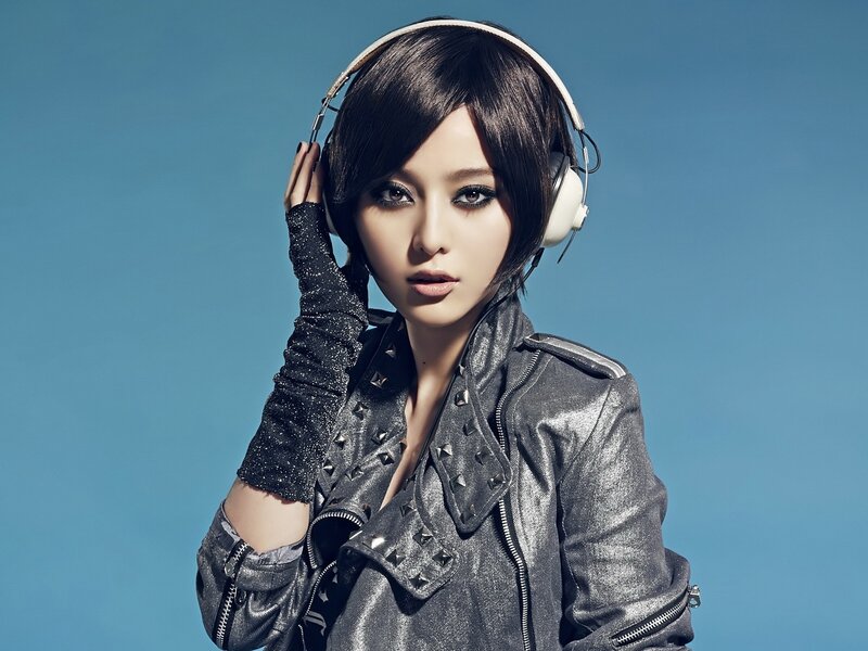 Woman Wearing Headphones — Blue, Confident, Photograph